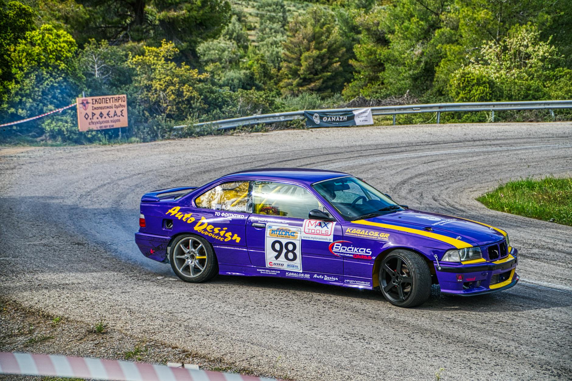 sports car drifting on a road